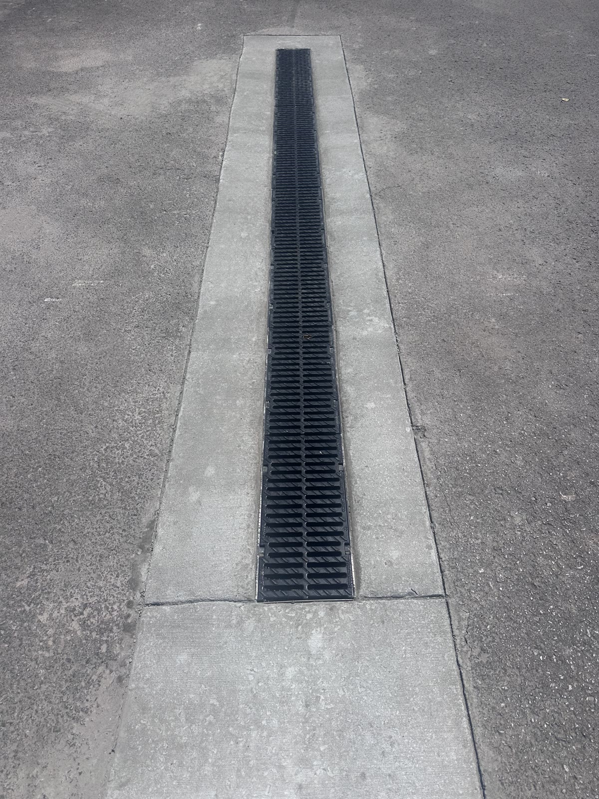 Heavy-duty trench drain set into a concrete channel