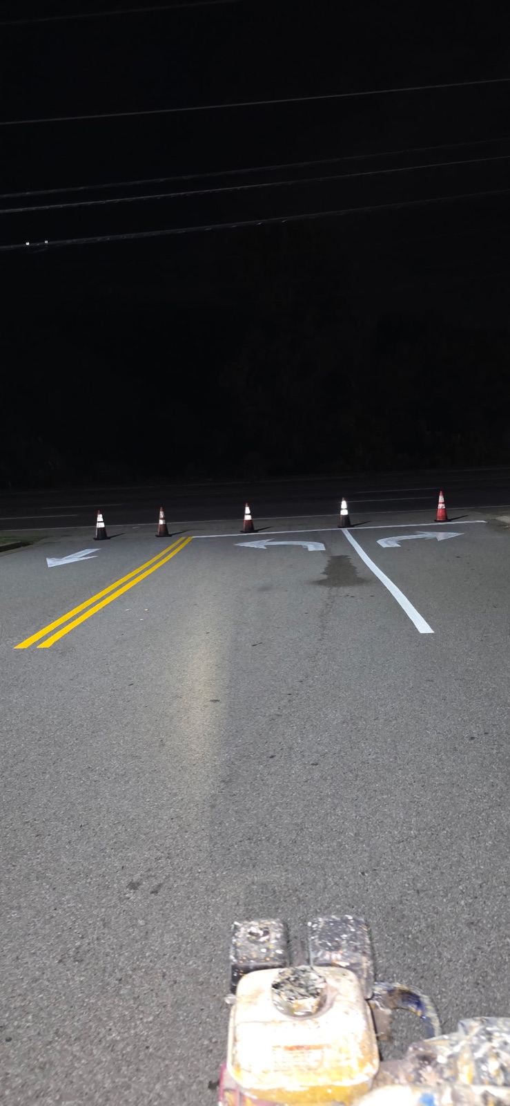 Fresh directional arrows and lane striping at a Clarksville commercial lot